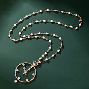 long gold-plated necklace in the shape of a watch